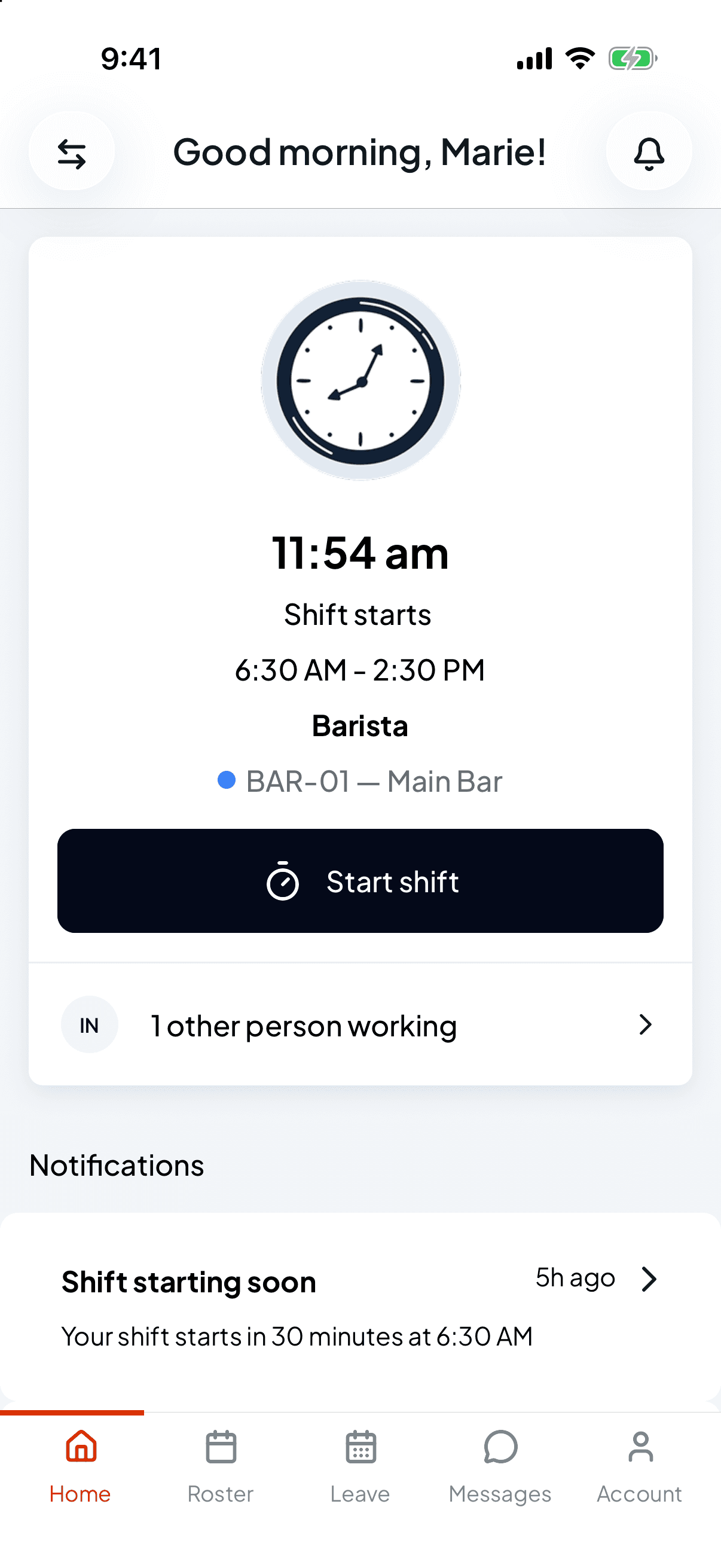 The Shiftly Me home screen showing a 6:30 AM to 2:30 PM Barista shift with the cost centre BAR-01 Main Bar, a Start shift button and 1 other person working