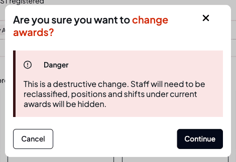 The change-awards confirmation warning that staff will need to be reclassified and positions and shifts under current awards will be hidden