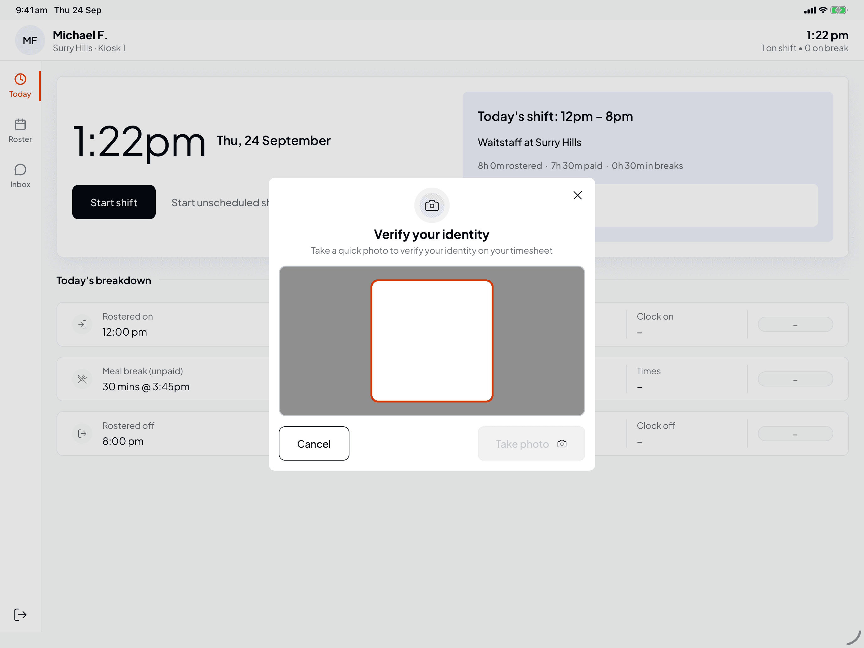 The Verify your identity window asking you to take a quick photo, with a camera frame, Cancel and Take photo